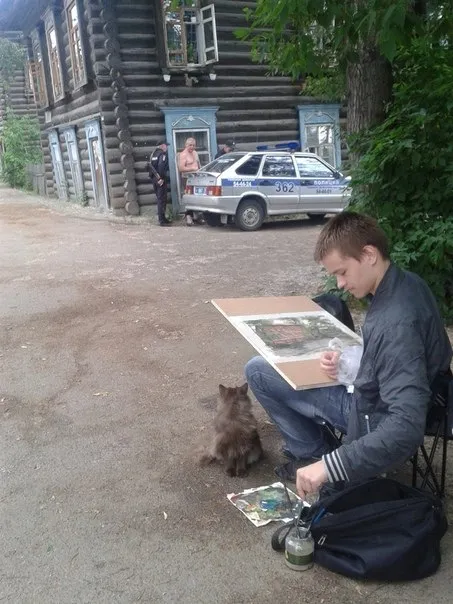 Уличный художник и кот