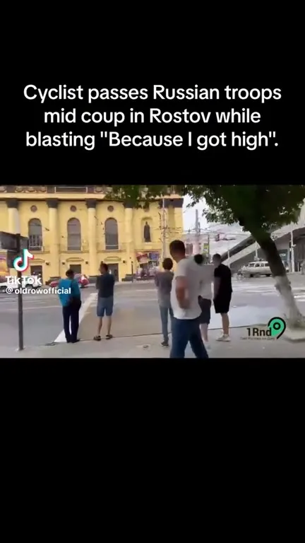 Cyclist Passes Russian Troops