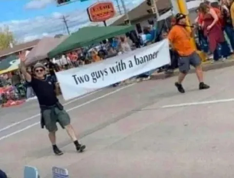 Two Guys With a Banner
