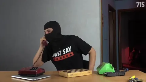 Masked Man Switches Phones