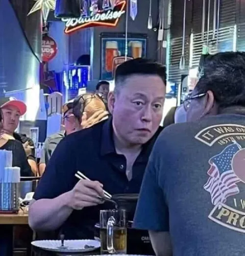 Elon Musk Eating With Chopsticks