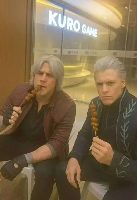 Serious Men Eating Skewers