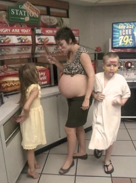 Pregnant Woman at the Grill Station
