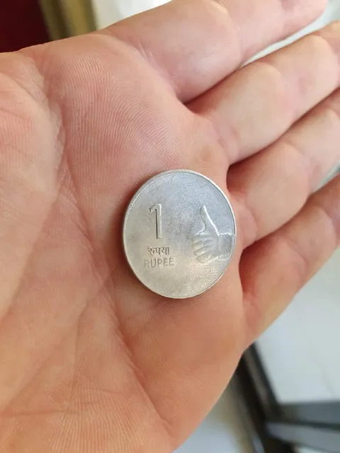 One Rupee Coin Thumbs Up