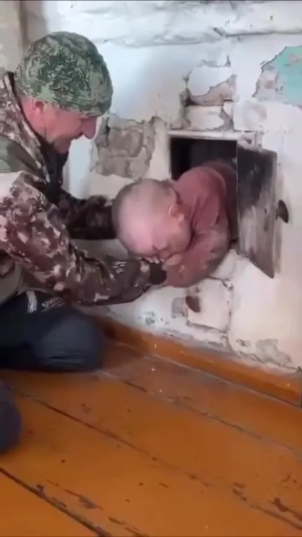 Ведьмак достаёт ребёнка из печи