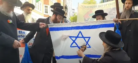 Men Cutting the Israeli Flag