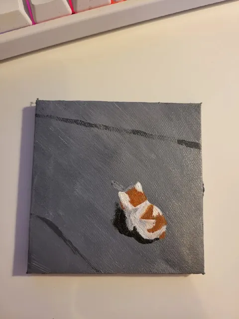 Рыжий кот на сером фоне