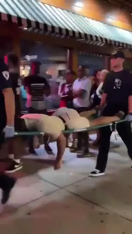 EMTs Carry the Reporter Away