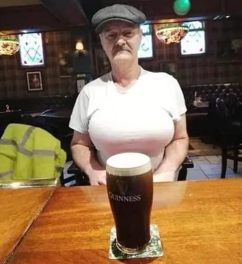 Woman Serving a Guinness