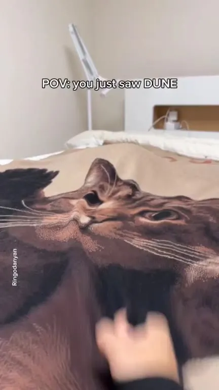 Cat Emerges Like a Sandworm
