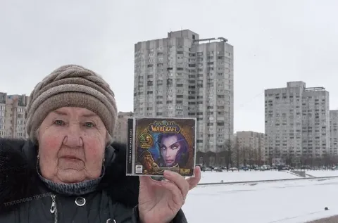 Elderly Woman Holds World of Warcraft