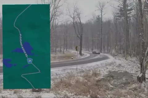 Snowy Road Sends Cars Sliding