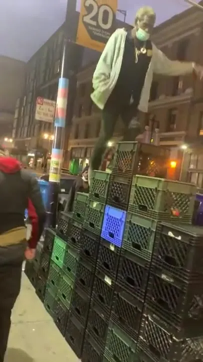 Man Climbs Crates, Then Crawls