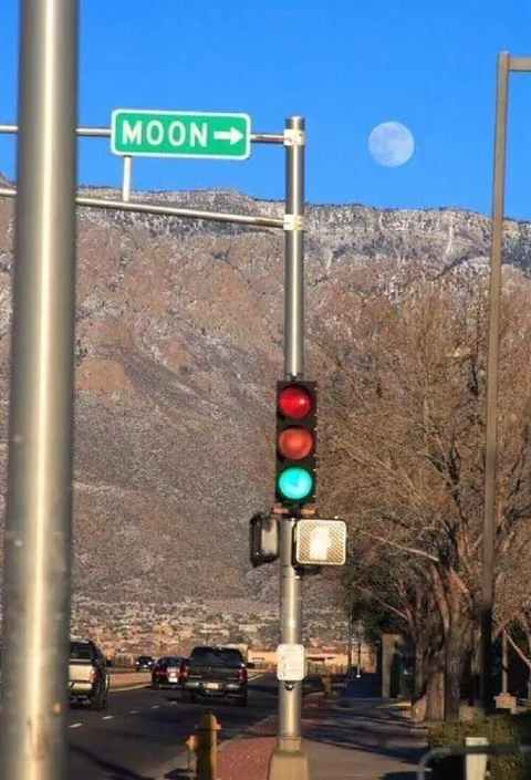 Road Sign Pointing to the Moon