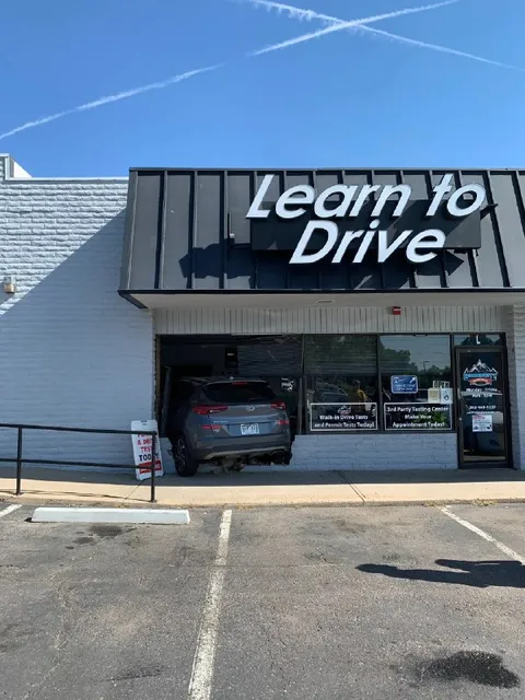 Car Crashes Into Driving School