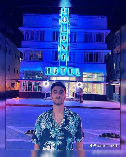 Man in Front of Hotel