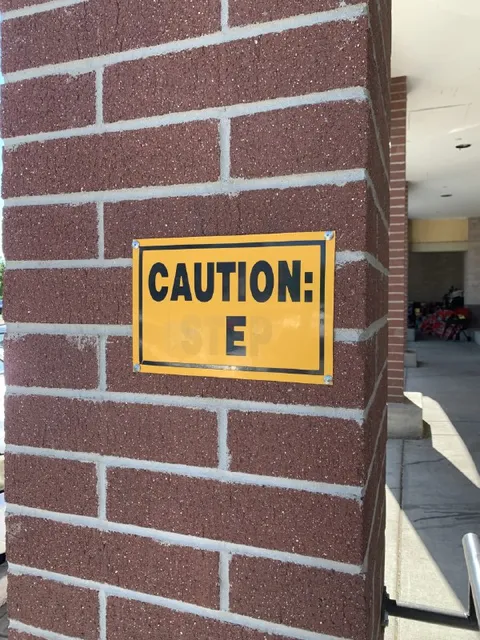 Caution: Step Sign