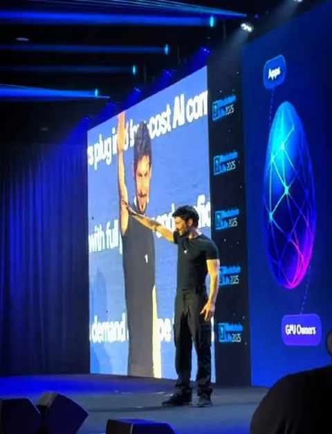 Man Points at Giant Screen