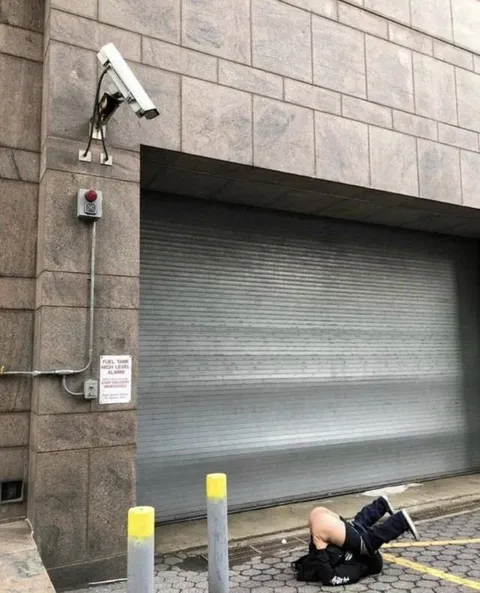 Man Collapses Under Security Camera