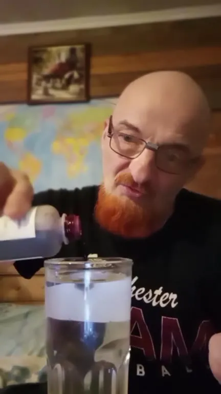 Man Makes a Suspicious Red Drink