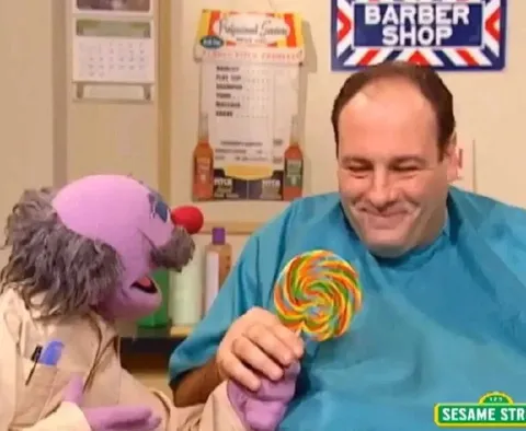 Man Sharing a Giant Lollipop