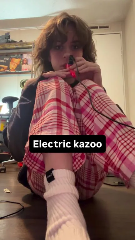 Girl Plays an Electric Kazoo