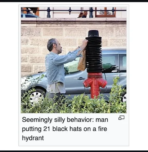 Man Puts 21 Hats on Hydrant