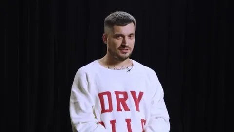 Suspicious Man in White Sweatshirt