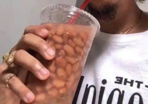 Man Drinking Beans