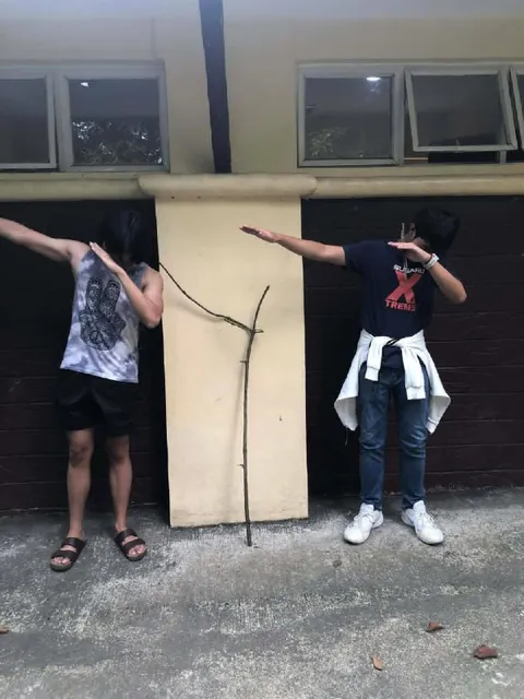 Two People Dabbing Together