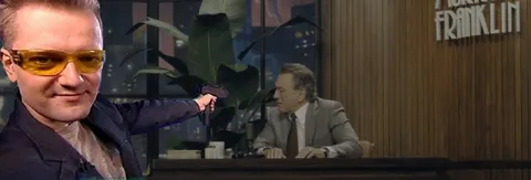 Man Pointing Gun at Host