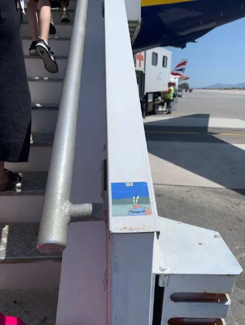 Sex Sticker on Airplane Stairs