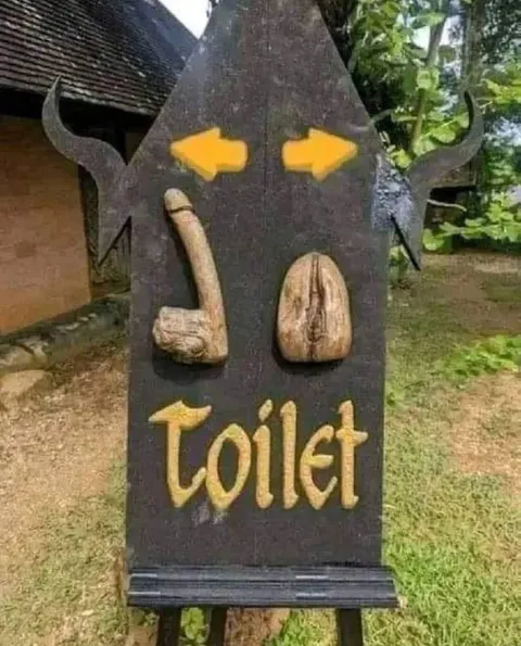 Primitive Toilet Sign
