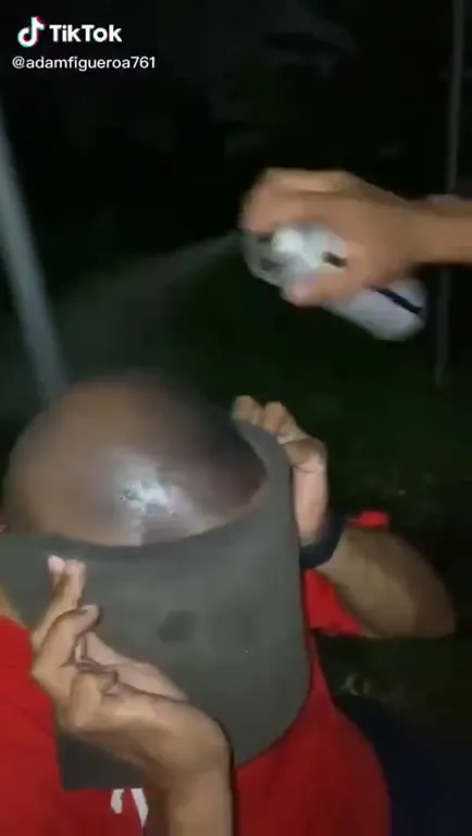 Man Hides Face and Laughs