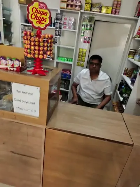 Confused Shopkeepers Behind the Counter