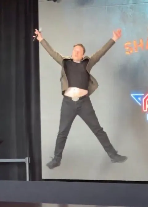 Man Celebrating on Stage