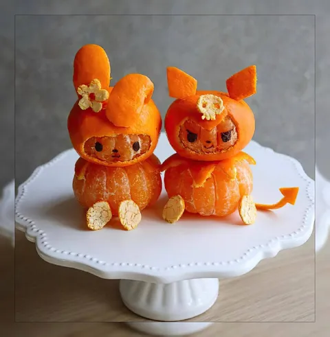 Мандариновые котики на тарелке