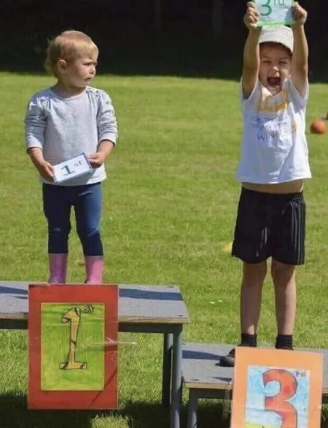 Third Place Celebrating While First Looks Sad