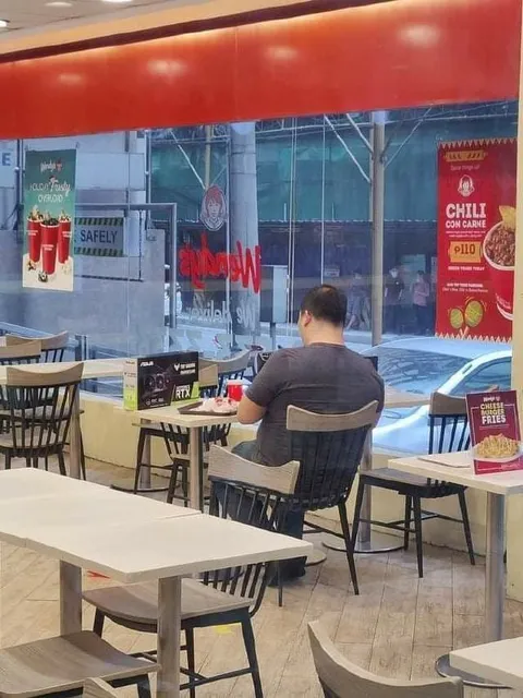 Man Alone in a Fast-Food Restaurant