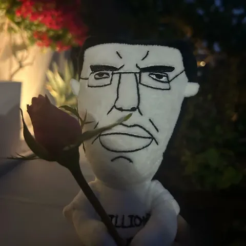 Stern Plush Holding a Rose