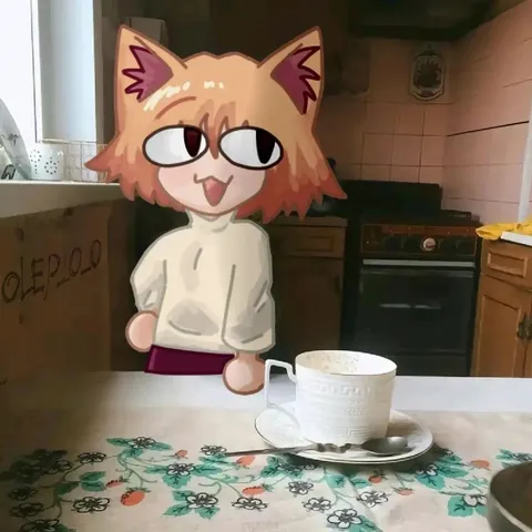 Кот пьёт чай на кухне