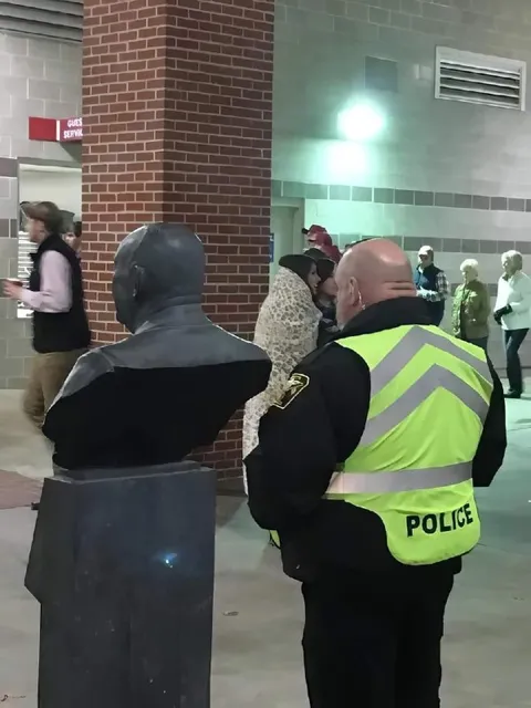 Police Officer and Bald Bust