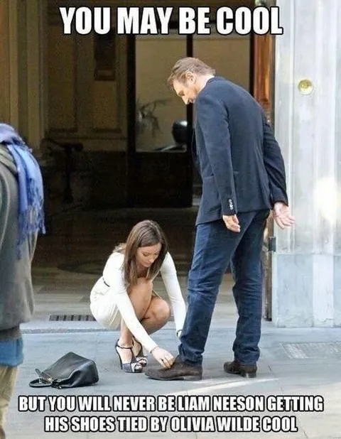 Liam Neeson Getting His Shoes Tied