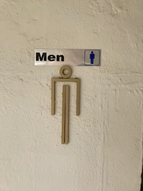 Malformed Men’s Room Sign