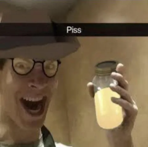 Man Holding a Jar of Piss