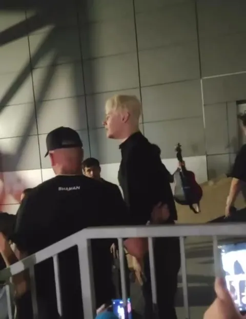 Blond Singer Waves to Fans