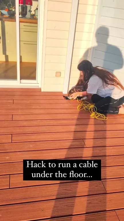 Cat Runs Cable Under Deck