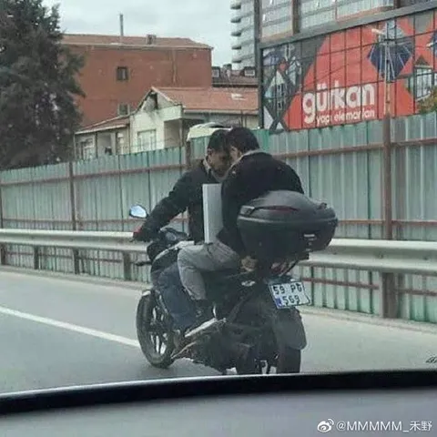 Overloaded Motorcycle Passenger