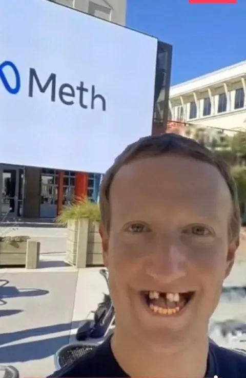 Man Smiling at Meth Sign