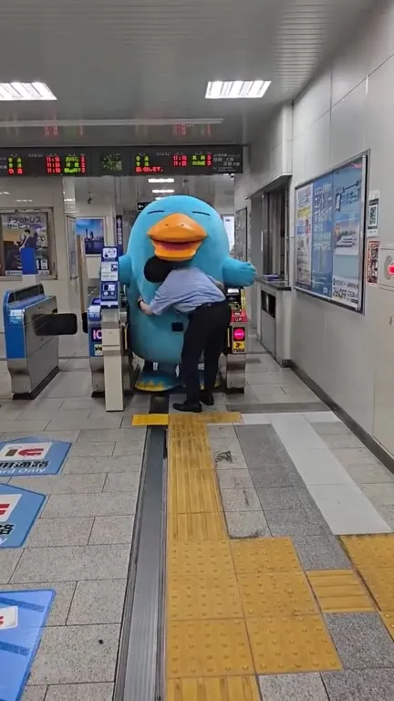 Mascot Blocks the Station Gate